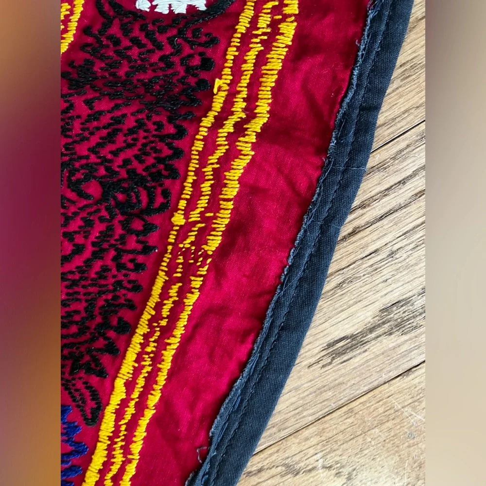 Suzane embroidered with cotton threads on cotton red fabric, hand made